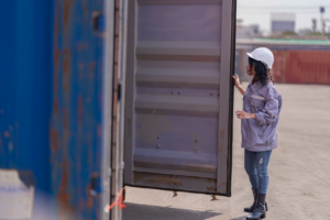 Loading cargo through the narrow end of a standard shipping container is one of the biggest frustrations in logistics. Forklifts struggle with long loads, workers waste time arranging items single-file, and oversized materials simply do not fit through a 7-foot-wide door. The open side container solves these problems by placing full-length doors along the long wall. In this guide, we cover what an open side container is, how the doors work, standard dimensions, real-world applications, pricing, and how it compares to other container types. Infinex can source open side containers for projects across Singapore in both new and used condition. What Is an Open Side Container? An open side container (also called a full-side access container, side-opening container, or side-door container) is a modified intermodal shipping container with bi-fold doors along one or both of its long walls instead of the conventional solid steel panels. While a standard container only has cargo doors on the short 8-foot wall, an open side container opens up the full 20-foot or 40-foot length of its side wall. This gives operators the ability to load, unload, and access cargo from the side rather than being restricted to end-loading only. The bi-fold doors are made from the same corrugated Corten steel as the rest of the container. When closed and sealed, the unit remains wind-tight and water-tight, just like a standard box. Structural integrity is maintained through a reinforced top rail, reinforced corner posts, and carefully engineered hinge systems. Open side containers are built to ISO standards and are compatible with standard container handling equipment. They are available in both 20ft and 40ft lengths, in standard height (8ft 6in) and high cube (9ft 6in) configurations. For a full breakdown of sizing, see our container sizes guide. https://app.envato.com/search/photos/0eb3cb14-fd6f-44ce-b3dc-915d3b4ac1ad?itemType=photos&term=Open+Side+Container&sort=relevance How Open Side Container Doors Work The door system is what sets the open side container apart. Understanding the mechanism, design variants, and opening options will help you choose the right configuration. Bi-Fold Door Mechanism Each door panel is made up of two hinged sections that fold against each other when opened, similar to a closet bi-fold door but built to industrial standards. The doors swing open between 180 and 270 degrees, and when fully opened, the panels fold flat against the adjacent wall or corner post, leaving the entire side opening completely clear. Each panel rides on heavy-duty hinges welded to vertical posts, designed to support 150 to 250 kg per panel while withstanding repeated opening and closing cycles. Doors can be opened individually or all at once, giving you flexibility for partial or full access. Door Configurations Full open-side (no centre post): Two large bi-fold assemblies meet in the middle. When opened, the entire wall is clear with no vertical obstruction. Best for very long or wide items. One-post/two-door: A single vertical centre post divides the side into two openings, each with its own bi-fold assembly. Adds structural rigidity while providing generous access. Four-door/three-post: Three vertical posts create four equal door sections. Highest structural strength, commonly chosen when stacking is required. Most open side containers also retain the standard end doors, giving you dual-access capability. Weatherproofing and Security Despite having an entire wall that opens, open side containers are engineered to be fully weather-tight when closed: Rubber gaskets: Continuous seals along every door edge, post junction, and threshold create a water-tight barrier Multi-point locking: Cam-action lock rods engage at the top, bottom, and middle of each door frame, with high-security padlock hasps Drainage channels: Door tracks and bottom rails direct water away from the interior Wind rating: Closed and locked units meet the same wind resistance standards as conventional containers, typically rated for sustained winds up to 150 km/h https://app.envato.com/search/photos/3e91e6b3-9ae2-4f67-a910-615e4992888f?itemType=photos&term=Open+Side+Container&sort=relevance Open Side Container Dimensions and Specifications Below are the standard dimensions for the most common open side container sizes. Exact measurements may vary slightly between manufacturers. 20ft Open Side Container (Standard and High Cube) Specification 20ft Standard 20ft High Cube External Dimensions (L x W x H) 6,058 x 2,438 x 2,591 mm 6,058 x 2,438 x 2,896 mm Internal Dimensions (L x W x H) 5,898 x 2,350 x 2,390 mm 5,898 x 2,350 x 2,690 mm Side Door Opening (W x H) 5,758 x 2,280 mm 5,758 x 2,585 mm End Door Opening (W x H) 2,340 x 2,280 mm 2,340 x 2,585 mm Tare Weight 2,550 to 2,800 kg 2,750 to 3,050 kg Maximum Payload 21,500 to 24,000 kg 21,000 to 24,000 kg Cubic Capacity 33.0 to 33.2 cbm 37.2 to 37.5 cbm 40ft Open Side Container (Standard and High Cube) Specification 40ft Standard 40ft High Cube External Dimensions (L x W x H) 12,192 x 2,438 x 2,591 mm 12,192 x 2,438 x 2,896 mm Internal Dimensions (L x W x H) 12,032 x 2,350 x 2,390 mm 12,032 x 2,350 x 2,690 mm Side Door Opening (W x H) 11,832 x 2,280 mm 11,832 x 2,585 mm End Door Opening (W x H) 2,340 x 2,280 mm 2,340 x 2,585 mm Tare Weight 4,200 to 4,800 kg 4,500 to 5,200 kg Maximum Payload 26,000 to 28,000 kg 26,000 to 28,500 kg Cubic Capacity 67.3 to 67.7 cbm 75.8 to 76.3 cbm Construction and Materials Open side containers use the same industrial-grade materials as standard shipping containers, with additional reinforcement to compensate for the opening side wall. Corten steel (weathering steel): Walls, roof, floor frame, and door panels are fabricated from Corten steel, which forms a protective rust layer that shields the underlying metal from corrosion. Ideal for containers exposed to rain, salt spray, and tropical humidity. Reinforced frame: The top side rail, corner posts, and bottom side rail are all reinforced with heavier gauge steel sections to maintain load-bearing capacity after removing the solid wall. Marine-grade plywood flooring: 28 mm thick, treated with insecticide and fungicide, rated to support forklift traffic and heavy point loads. Forklift pockets: Standard ISO-spaced pockets built into the base for lifting and repositioning. Heavy-duty hardware: Forged steel hinges designed for tens of thousands of cycles. All lock rods, handles, and cam keepers are zinc-plated or galvanised. Multi-layer coating: Zinc-rich primer, intermediate epoxy coat, and marine-grade polyurethane topcoat for long-term corrosion protection. Advantages of Open Side Containers Full forklift access from the side. A forklift can approach perpendicular to the container and place pallets anywhere inside without driving through a narrow 8-foot corridor. Faster loading and unloading. Multiple workers or machines can operate along the open side simultaneously. Side-loading can reduce handling time by 30% to 50% compared to end-loading. Oversized cargo capability. Items wider than the 7 ft 8 in end door can be loaded through the side opening, which stretches up to 38 ft 10 in on a 40ft unit. Reduced cargo damage. Items can be placed directly into position rather than being dragged or tilted through a narrow door. Easy access to all cargo. Every item is immediately reachable from the side, making inventory management and partial unloading far more practical. Outstanding conversion potential. The full-length opening is perfect for large windows, folding walls, serving hatches, or roll-up shutters, making these containers ideal for customised solutions. Storefront and display capability. When opened, the container creates a natural covered shopfront. The roof provides shade and rain protection while the full interior is visible. Weather-tight when closed. Rubber gaskets and multi-point locks ensure the container is fully sealed, meeting the same standards as conventional containers. Strong resale value. Limited supply and strong demand mean open side containers hold their value well. https://app.envato.com/search/photos/1325f9a0-18cb-4bc5-bef3-f56045e3edf1?itemType=photos&term=Open+Side+Container&sort=relevance Disadvantages of Open Side Containers Higher purchase cost. Open side containers cost approximately 1.5 to 2 times more than a comparable standard container due to complex door engineering and reinforced framing. Heavier tare weight. The reinforced frame and bi-fold doors add 200 to 500 kg, slightly reducing maximum payload capacity. Limited availability. These are a specialty product with limited production volumes. Lead times for new orders are typically 8 to 14 weeks. Used open side containers are particularly scarce. Lateral clearance required. The bi-fold doors need 600 to 800 mm of clearance to swing open, which can be a constraint in tight spaces. Reduced stacking capacity. Most are rated for 3 to 5 high stacking when empty, compared to 6 to 9 for standard containers. Always check the CSC plate. Door maintenance. Hinges, lock rods, and gaskets require periodic lubrication and inspection, especially in coastal or tropical environments. Open Side Container Uses and Applications Construction sites. Side-loading allows teams to store and access timber, steel beams, pipes, scaffolding, and heavy equipment without tight end-door manoeuvring. Multiple trades can access different sections simultaneously. Browse our range of products suitable for construction. Warehousing and distribution. Open side containers serve as flexible overflow storage during peak seasons. Side access makes pick-and-pack operations faster and enables proper first-in, first-out inventory rotation. Retail pop-up shops and events. When opened, the container transforms into a sheltered, branded retail or food-service space. Lockable when closed for overnight security. Ideal for markets, festivals, product launches, and trade shows. Agriculture. The side access is useful for loading large hay bales with a tractor-mounted loader or storing equipment too wide for standard doors. Military and emergency services. Side-loading enables rapid deployment and distribution of supplies, equipment, and field infrastructure in time-sensitive operations. Modular conversions. The pre-engineered full-length opening saves significant fabrication costs compared to cutting and reinforcing a standard container wall. Architects use these for offices, studios, cafes, garages, and modular homes. Explore Infinex customised container solutions for conversion options. Open Side Container vs Other Container Types Feature Open Side Standard Double-Door (Tunnel) Curtain-Sided Open Top Side wall access Full-length bi-fold doors Fixed steel panel Fixed steel panel PVC/canvas curtains Fixed steel panel End doors Standard double doors Standard double doors Double doors on both ends Standard double doors Standard double doors Loading direction Side and end End only Both ends Side and end Top and end Max opening width (40ft) Up to 38 ft 10 in 7 ft 8 in 7 ft 8 in (each end) Full side length 7 ft 8 in Security level High (steel doors, multi-point locks) High High Low (curtains can be cut) Medium (tarpaulin roof) Weather tightness Full (gaskets and locks) Full Full Partial Partial Stacking capacity 3 to 5 high 6 to 9 high 5 to 7 high 2 to 3 high 4 to 6 high Tare weight (20ft) 2,550 to 2,800 kg 2,200 to 2,350 kg 2,400 to 2,600 kg 2,300 to 2,500 kg 2,300 to 2,500 kg Price (20ft new) $6,500 to $9,500 $3,000 to $5,000 $4,000 to $6,500 $5,000 to $7,500 $4,500 to $7,000 Availability Limited Widely available Moderate Limited Moderate Best for Side access, oversized cargo, conversions General cargo, shipping Drive-through access Fast roadside loading Top-loading with crane Open Side Container Pricing Open side container prices depend on size, condition, door configuration, and market availability. Below is a guide to current pricing in the Singapore and Southeast Asian market. Condition 20ft Price (USD) 40ft Price (USD) New (one-trip) $6,500 to $9,500 $9,500 to $15,000 Refurbished $5,000 to $7,000 $7,500 to $11,000 Used (good condition) $4,000 to $6,000 $6,000 to $9,000 40ft high cube open side containers sit at the upper end of these ranges due to additional material and higher demand. Used open side containers are significantly harder to find than used standard containers. When available, check the condition of doors, gaskets, hinges, and locking mechanisms carefully, as these components experience the most wear. Check our used container inventory for current availability. Why Open Side Containers Cost More The higher price reflects complex bi-fold door engineering, heavier structural reinforcement, specialised hardware components, lower production volumes, and additional quality control testing for door alignment and gasket sealing. For container accessories such as additional locks, shelving, or lighting to complement your open side container, visit our accessories page. https://app.envato.com/search/photos/5a67a99c-d148-4bdd-a4c8-2672d08942e6?itemType=photos&term=Open+Side+Container&sort=relevance Frequently Asked Questions 1. What is an open side container used for? An open side container is used for any application that benefits from full-length side access, including construction site storage, warehousing, retail pop-up shops, agricultural storage, military logistics, and modular building conversions. 2. Can an open side container be shipped by sea? Yes. Open side containers are built to ISO standards and can be shipped on container vessels, trailer chassis, and rail. Ensure the doors are properly secured and sealed according to carrier requirements. 3. Are open side containers waterproof? Yes. When all doors are closed and locked, the rubber gaskets and multi-point locking system create a weather-tight seal meeting the same standards as conventional shipping containers. 4. Can I stack open side containers? Yes, but with reduced capacity. Most are rated for 3 to 5 high stacking when empty. Always check the CSC plate on the specific unit for its approved stacking weight. 5. Can the side doors be removed? Yes. The bi-fold doors are mounted on bolt-on hinges and can be removed if a permanent full-side opening is desired. This is commonly done for conversion projects. 6. Do open side containers have end doors too? Most open side containers retain the standard double doors on the short end wall, giving you dual-access capability. Side-only models (no end doors) are less common. 7. Can I convert an open side container into a shop or office? Absolutely. Open side containers are among the most popular choices for container conversions. The full-length opening provides a ready-made shopfront, display area, or large window opening. Infinex offers customised container solutions for fit-outs of all types. 8. How quickly can I get an open side container in Singapore? New one-trip containers typically have lead times of 8 to 14 weeks. In-stock units can often be delivered within 3 to 7 business days. Contact Infinex for availability and pricing through our services page or contact us directly to discuss your requirements.